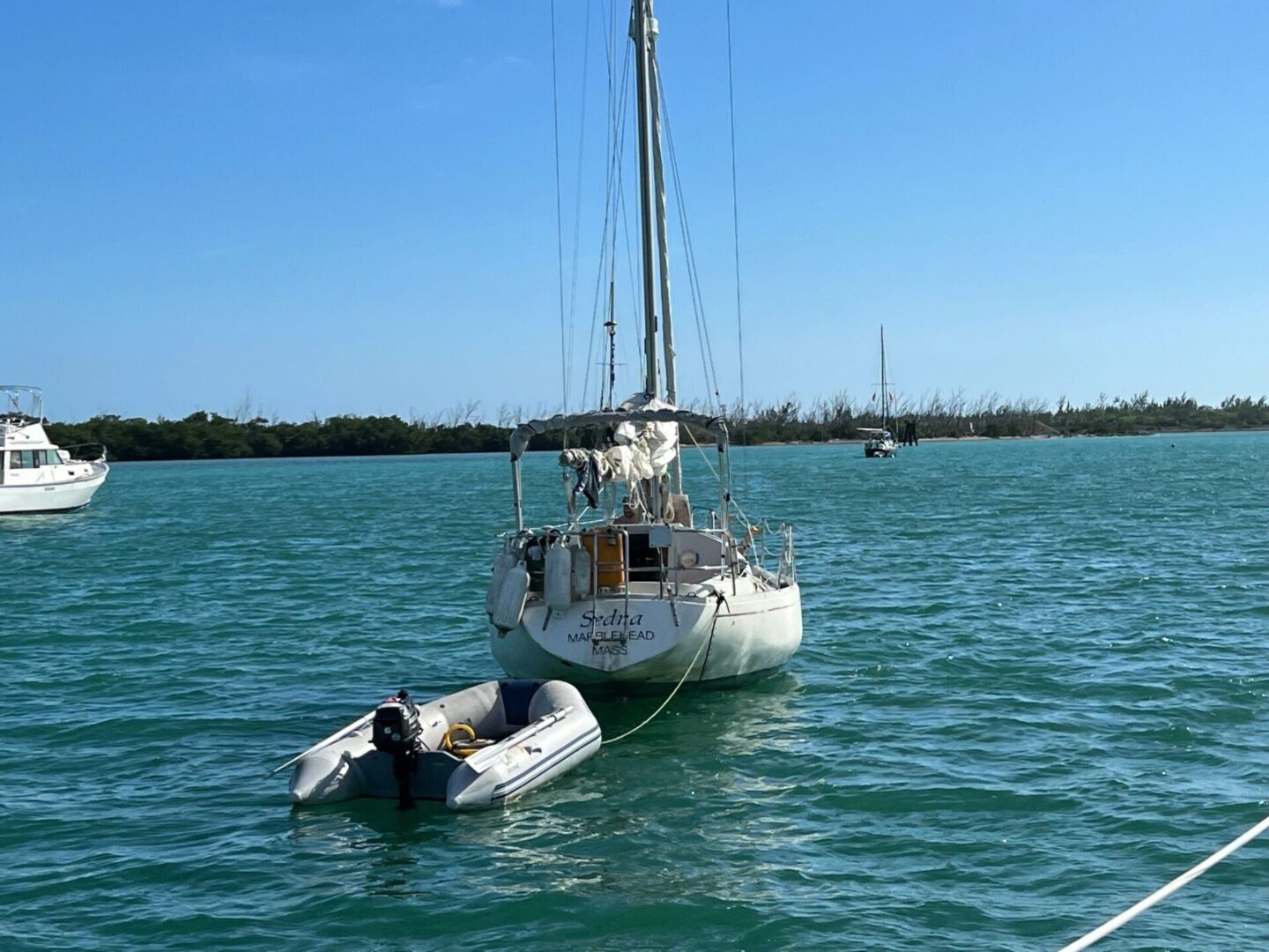 A boat is tied to the side of a boat in the water.